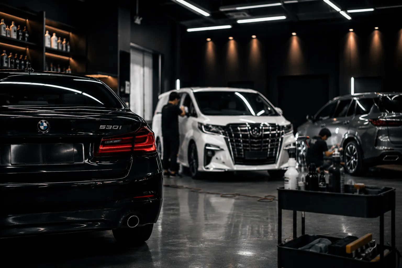 Premium automotive studio with BMW, Alphard and SUV inside the Facial of Cars detailing bay